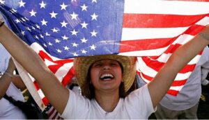 woman holding an american flag